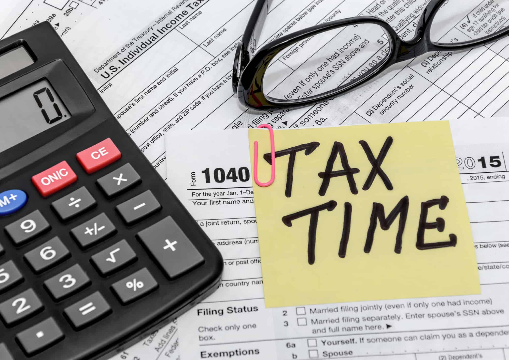 Tax Form With Callculator And Glasses